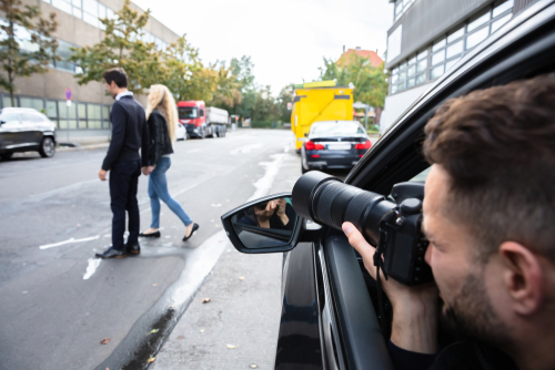 private investigator taking photo of cheating spouse