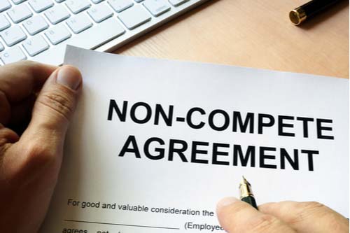 Man signs non-compete agreement