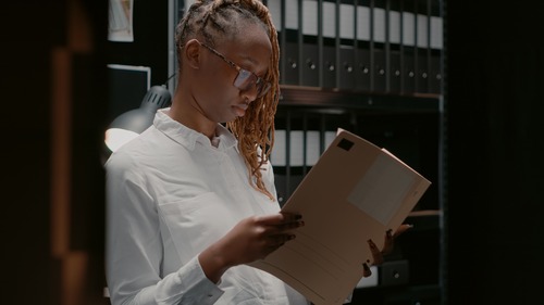 Private Investigator Looking at Files