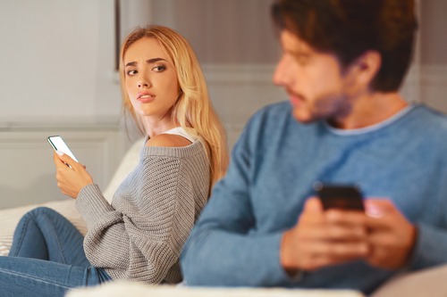 Woman Looking at Husband Suspiciously