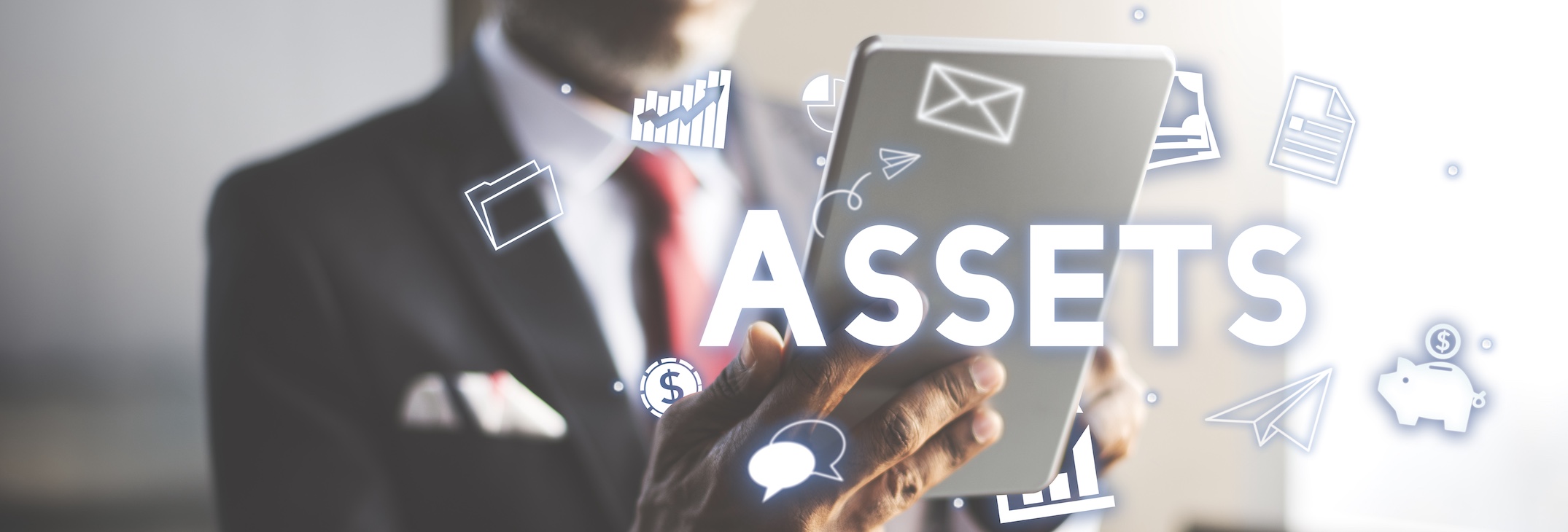 A businessman in a suit holding a tablet with digital financial icons and "ASSETS" text overlay representing asset searches and wealth investigation.