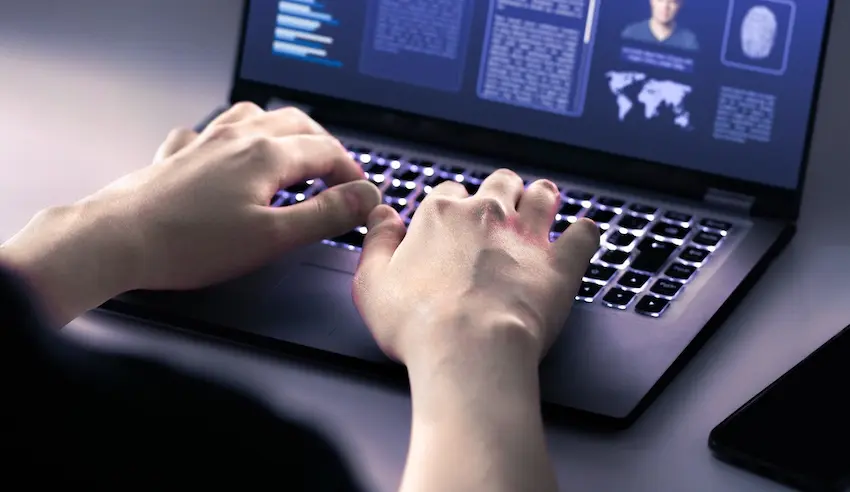 HR compliance documentation is being digitally processed and analyzed on a computer system for investigation.