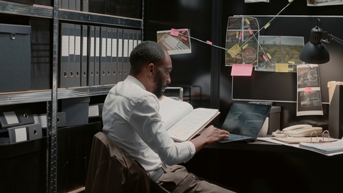 A picture of a private investigator locating a biological family member.